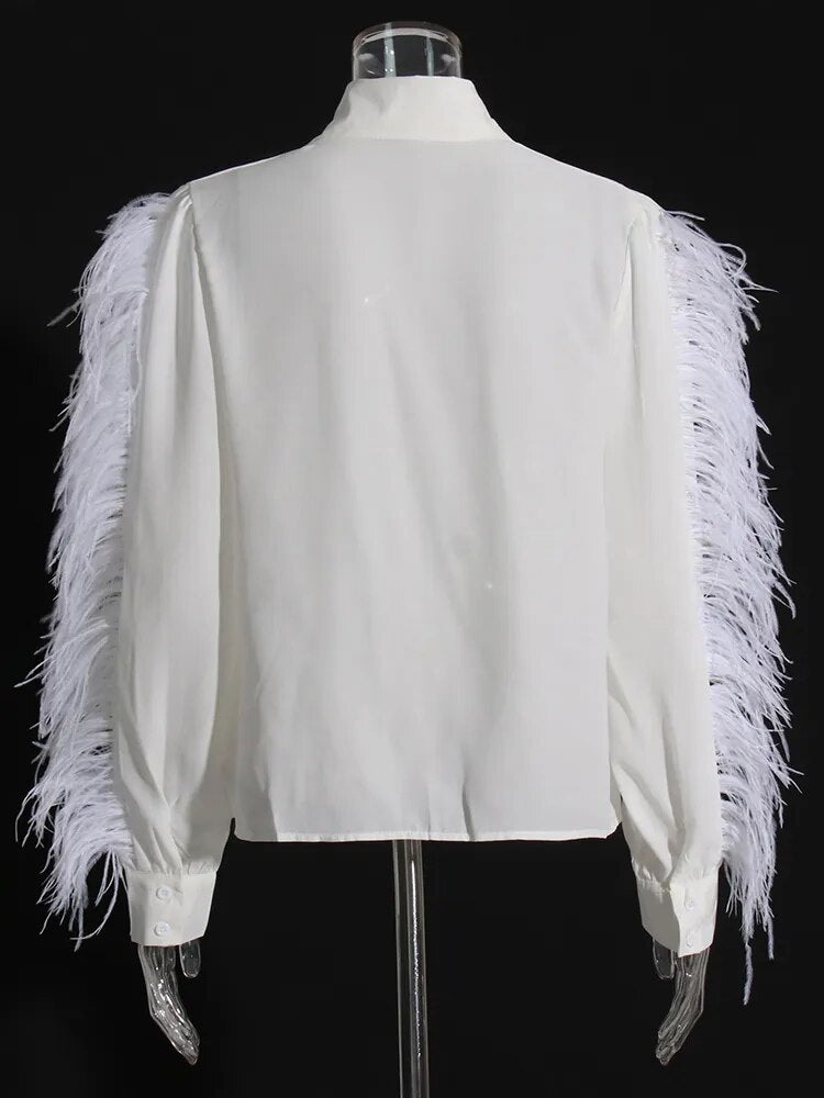 White long sleeve blouse with feather trims