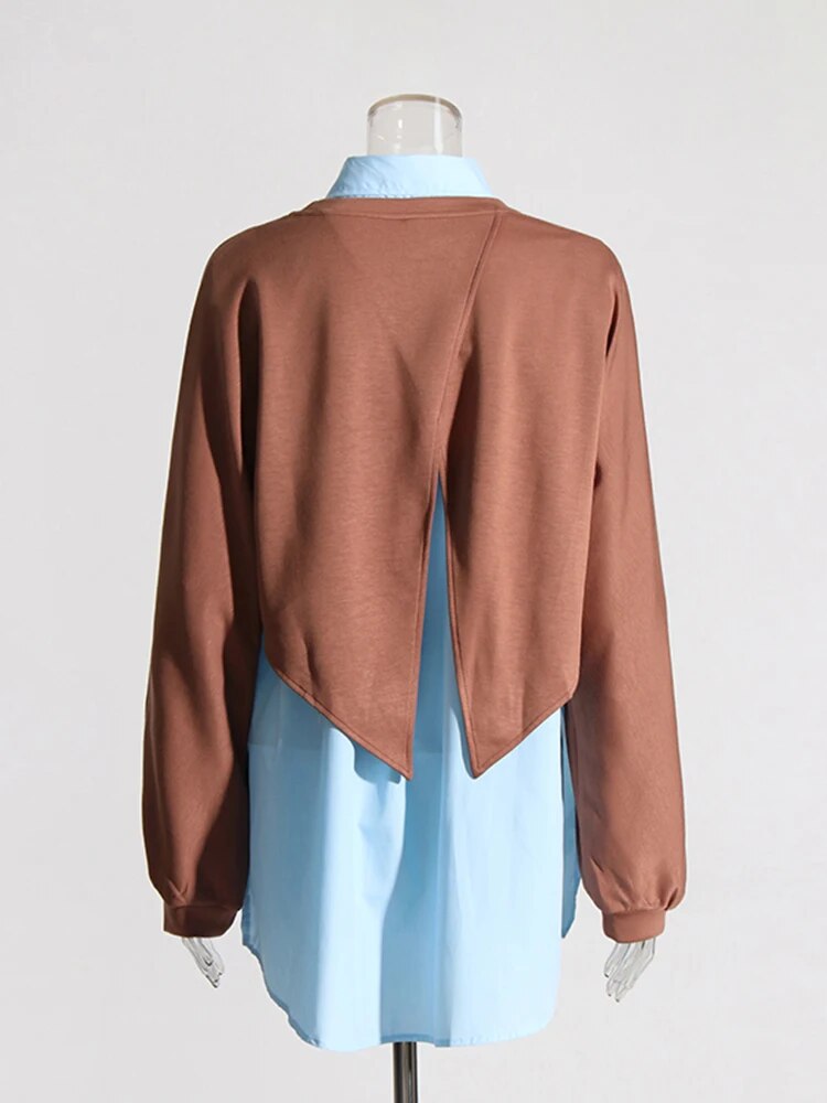 blue shirt with a layered brown knit