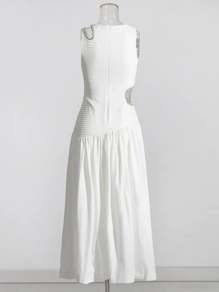 white midi dress with rhinestone trim cutouts