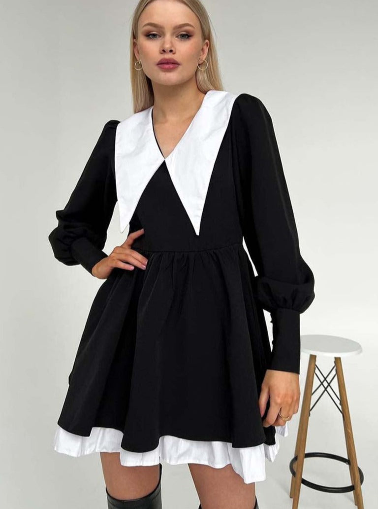 Black mini dress with white doll collar and long sleeves